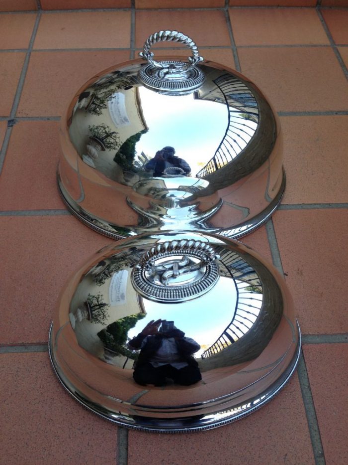 A Pair Of Graduated Silverplated Meat Domes By Walker & Hall   