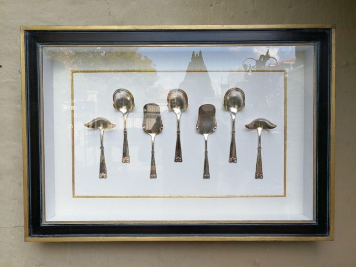 A Collection of Silver Plate Serving Flatware Framed in a Hand-made Frame