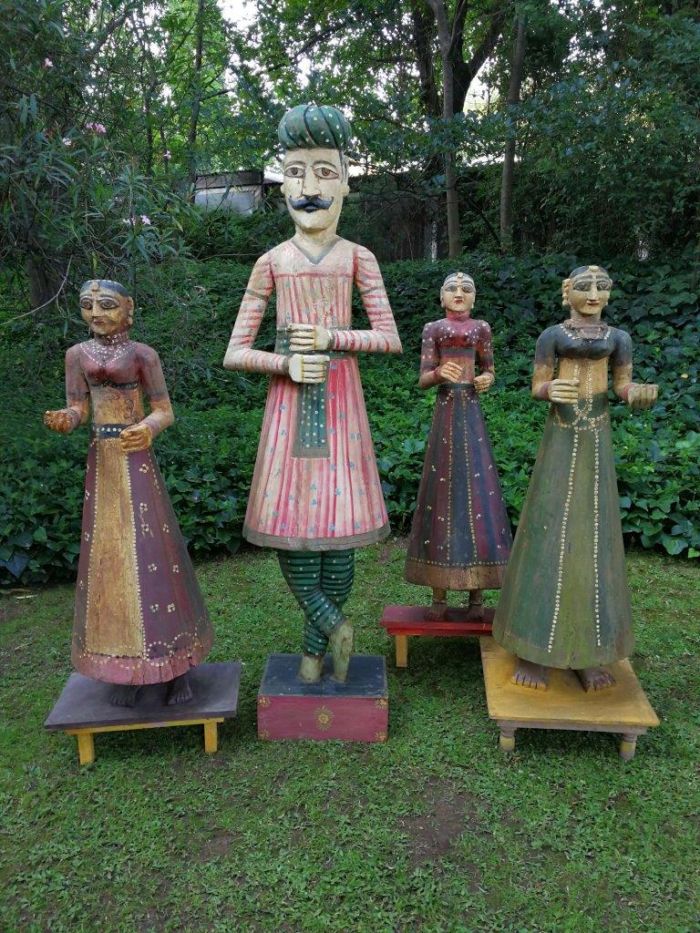 A Set of 4 Tall  Holy Indian Figurines (possibly antique but over 50 years old or older Gangaur Gavar holy figurines) with a male gate watcher and 3 females)