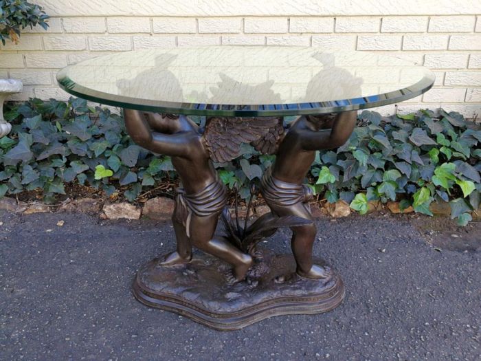 A Large Bronze Cherub Table Base with Glass Top ND