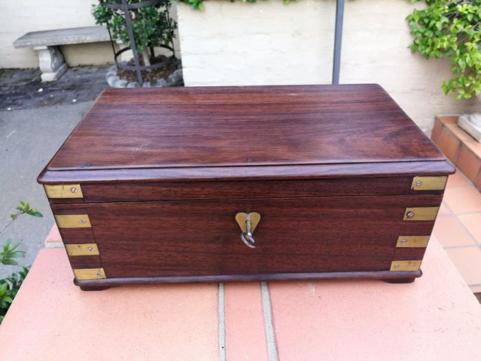 A Mahogany Polished Box With Brass details and Escutcheon and Key