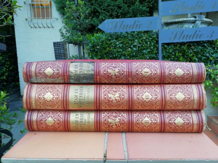 A Set Of Late 19th Century Circa 1885/1890 Extra-Large Size Decorative Books Entitled Stam En Wapenboek Van Aanzienlijke Nederlandsche Familien In Red Hardcovers With Gilt-Lettering And Tooling - Image 2