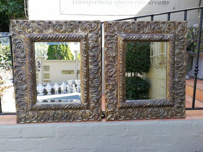 A Pair Of  20th Century Bevelled And Gilt-Painted Wooden Mirrors