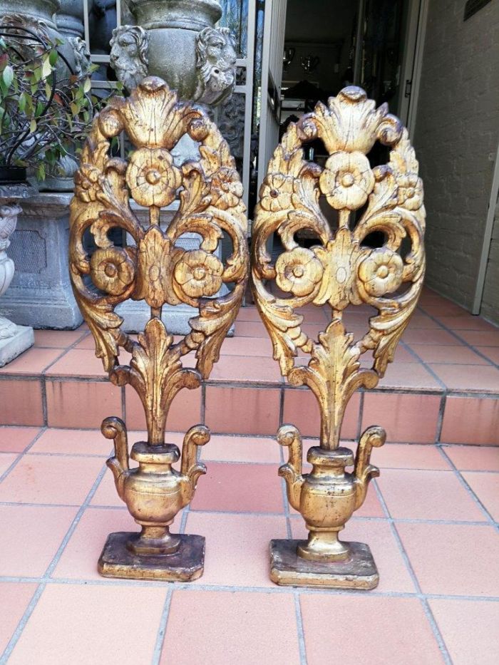 An Early 20TH Century Pair Of Gilt-Wood Carved Decorative Objects