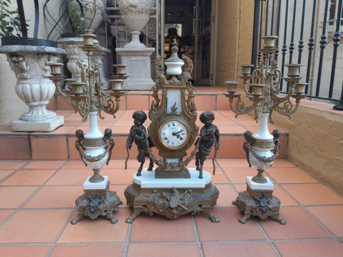 A 20th Century Brass Clock And Candelabrum Garniture Set