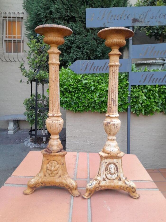 A 20th Century French Pair Of Cast Iron Candle Sticks