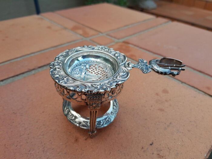 A 20TH Century Dutch Hallmark Silver Tea Strainer On Stand