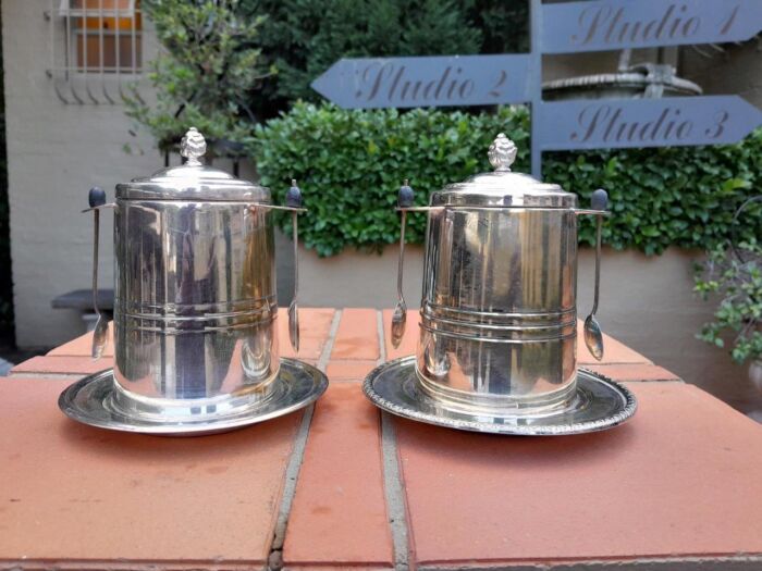 A Rare Pair of Silver Plate Tea Caddies (Regular and Decaf Tea)  each with Two Teaspoons with Removable Inners