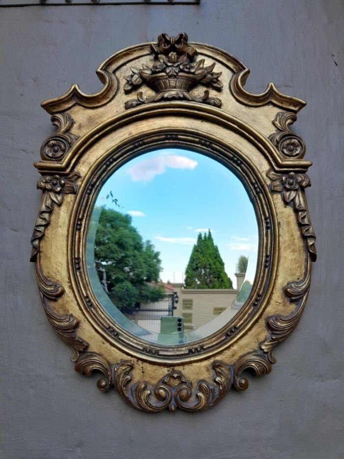 A 20th Century Carved and Gilded Bevelled Oval Mirror