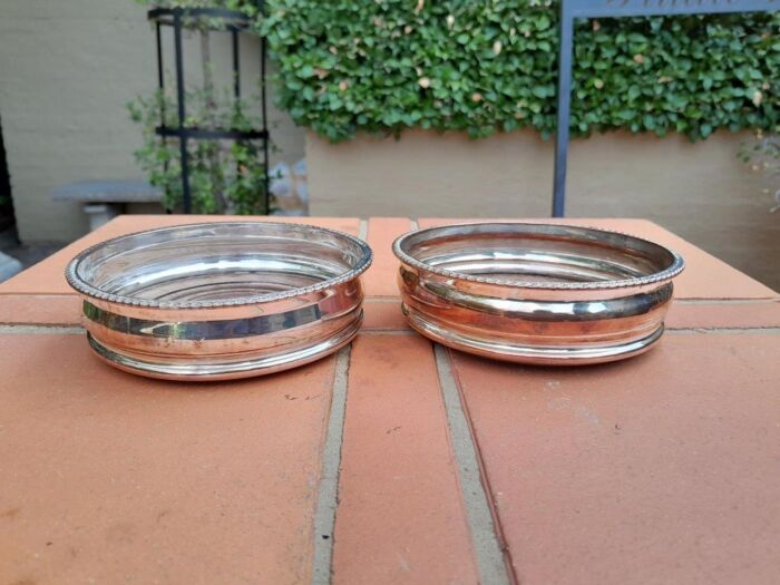 A 20th Century Pair of Silver- plate Wine Coasters with Wooden Bases