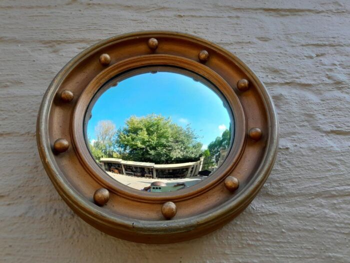 An early 20th Century Circa 1920 Regency Style Giltwood Mirror with Convex Frame