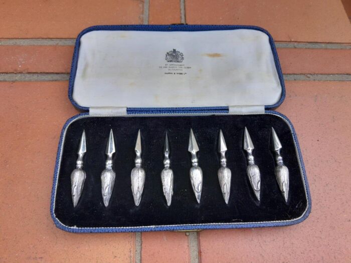 An Early 20th Century Mappin and Webb Cased Set of Eight Silver Plate Corn Holders