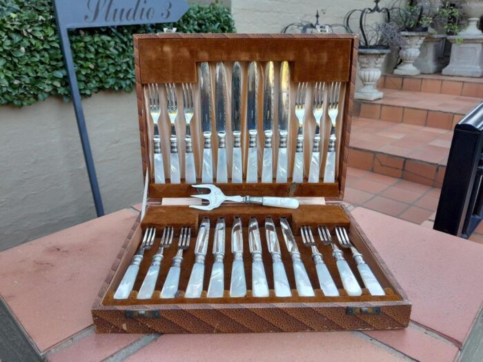 A Late 19th / Early 20th Century Silver Plate Cased Set of Twelve Fruit Forks and Knives and Fruit Server With Mother of Pearl handles