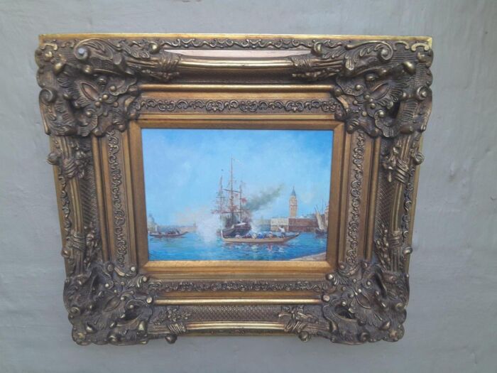 A 20th Century Continental School Oil on Canvas Ship Painting in a Ornately Carved and Gilded Frame