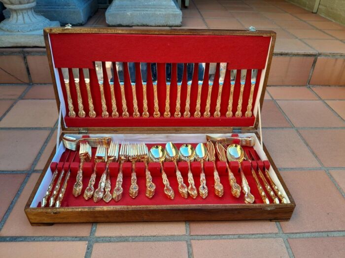 A Canteen Of 24kt 12 Place Ornately Gold Plated Stainless Steel Cutlery Set