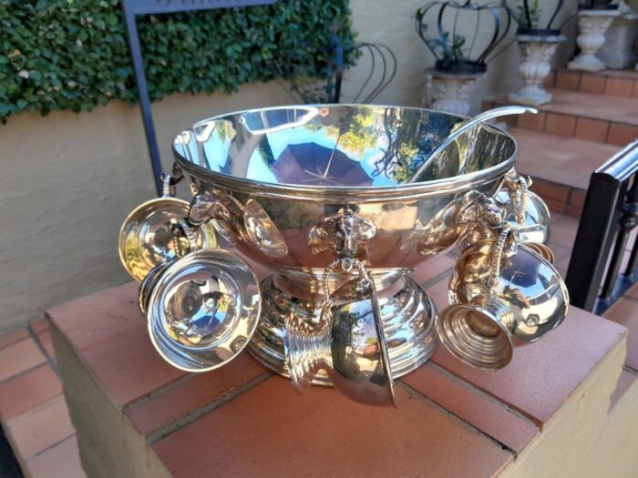 A 20th Century A1 Silver-Plate Punch Bowl With Eight Cups And Hooks And Ladle With Elephant Head