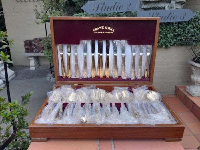 A Grawe And Hill Gold-Plated Cutlery Set With Maroon Lining In A Canteen