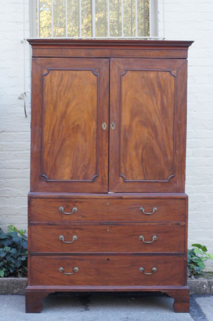 A Late 19th Century/Early 20th Century Victorian Mahogany Linen Press  on Bracket Feet