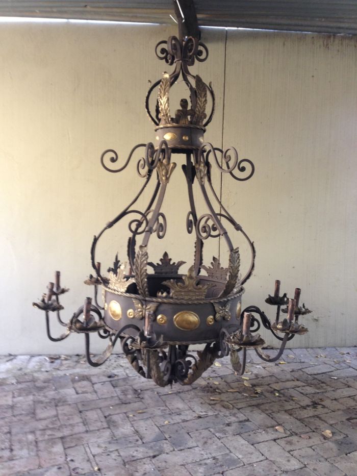 A Large Wrought Iron and Hand-Painted Imported Chandelier with Crown Detail